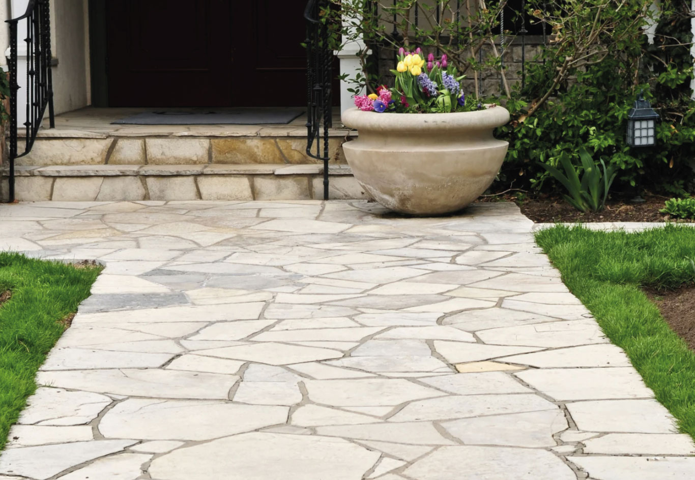 Flagstone front walkway with planter
