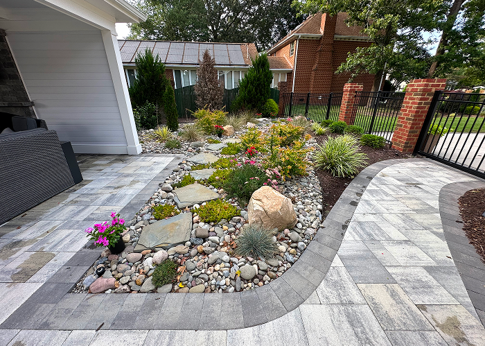 Low maintenance garden bed with river rock